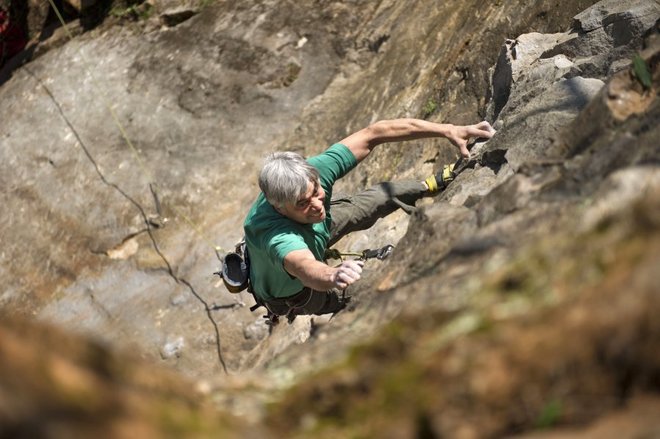 Kelly Brown, a member of the "Crag Committee," tests his skills on a bolted route called Scruffy City Blues at Ijams Nature Center's crag on March 28, 2015. Ijams has been forced to close the unique climbing area because of insurance. (PAUL EFIRD/NEWS SENTINEL)