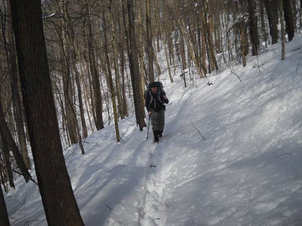 Grady plods through the thick snow as we ascend Miry Ridge to campsite ...
